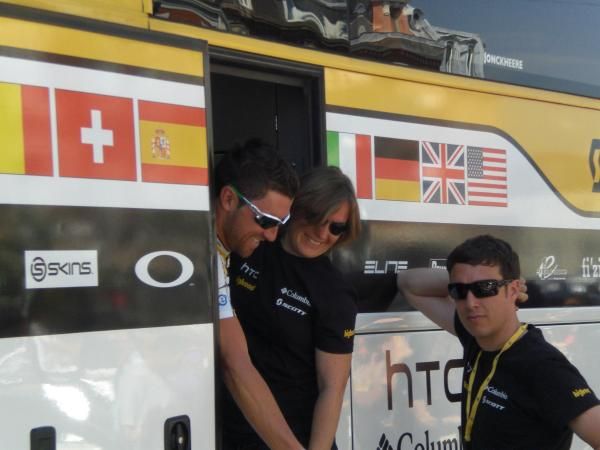 Bernard Eisel squeezes past Kristy Scrymgeour, the team's PR agent.