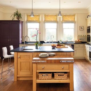 oak painted kitchen with wooden flooring and countertop