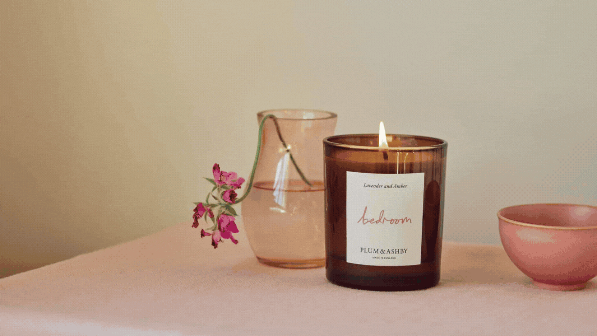 A GIF of minimalist scented candles from Plum & Ashby, Jo Malone London, Loewe, Maison Margiela