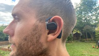 Cleer Arc Open Ear True Wireless Headphones worn on ear