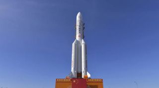 The Chinese Long March-5 rocket carrying China's Tianwen-1 Mars mission rolls out to the launch pad on July 17, 2020.