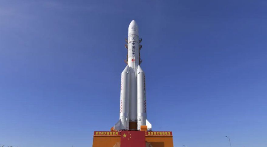 The Chinese Long March-5 rocket carrying China's Tianwen-1 Mars mission rolls out to the launch pad on July 17, 2020.