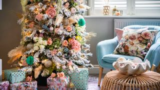 Christmas tree theme with boho feathers and faux flowers