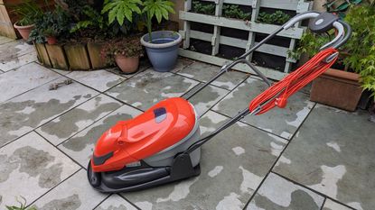 Flymo Easiglide 300v Electric Hover lawn mower on a patio