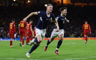 Scott McTominay celebrates his second goal against Spain with Kieran Tierney