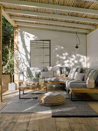 rattan furniture filled with cushions outdoors