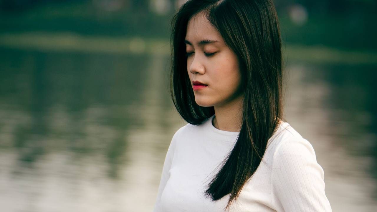 Woman breathing outside in nature