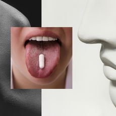 two black and gray greek goddess noses on either side of a close up of a woman's mouth with her tongue out balancing a white pill