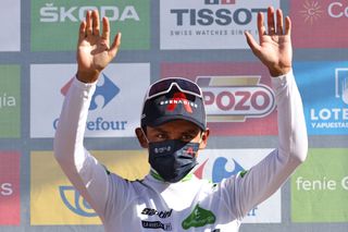 Team Ineos Colombian rider Egan Bernal celebrates on the podium retaining the Best Youngs white jersey after the 7th stage of the 2021 La Vuelta cycling tour of Spain a 152 km race from Gandia to Balcon de Alicante in Tibi on August 20 2021 Photo by JOSE JORDAN AFP Photo by JOSE JORDANAFP via Getty Images