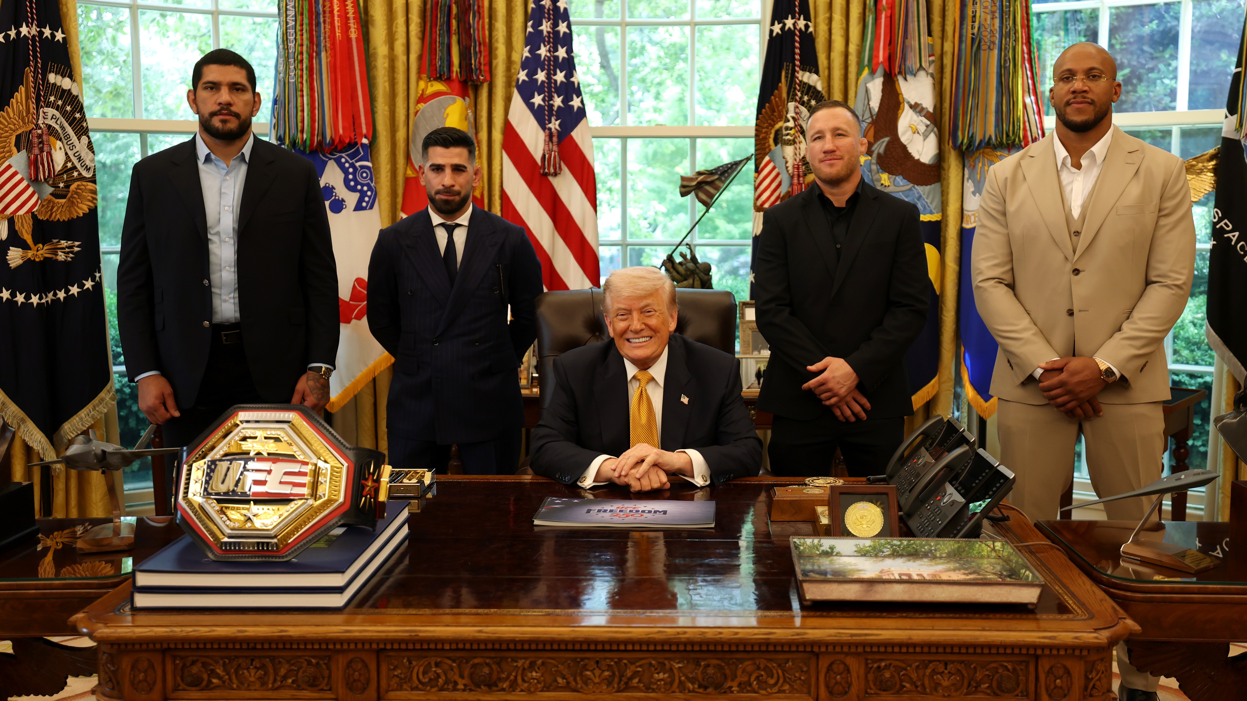 President Donald Trump poses for a photo in the Oval Office alongside UFC Freedom 250 fighters Ilia Topuria, Alex Pereira, Justin Gaethje, and Ciryl Gane at the White House on May 06, 2026