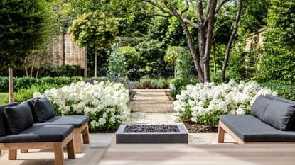 large garden ideas: patio space with brick and gravel pathway