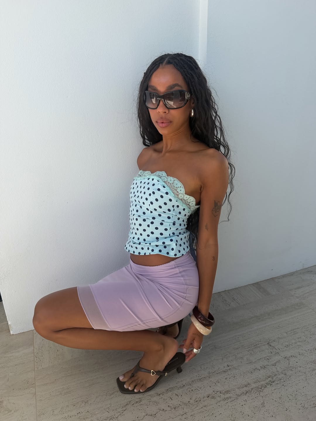 influencer wearing wraparound sunglasses