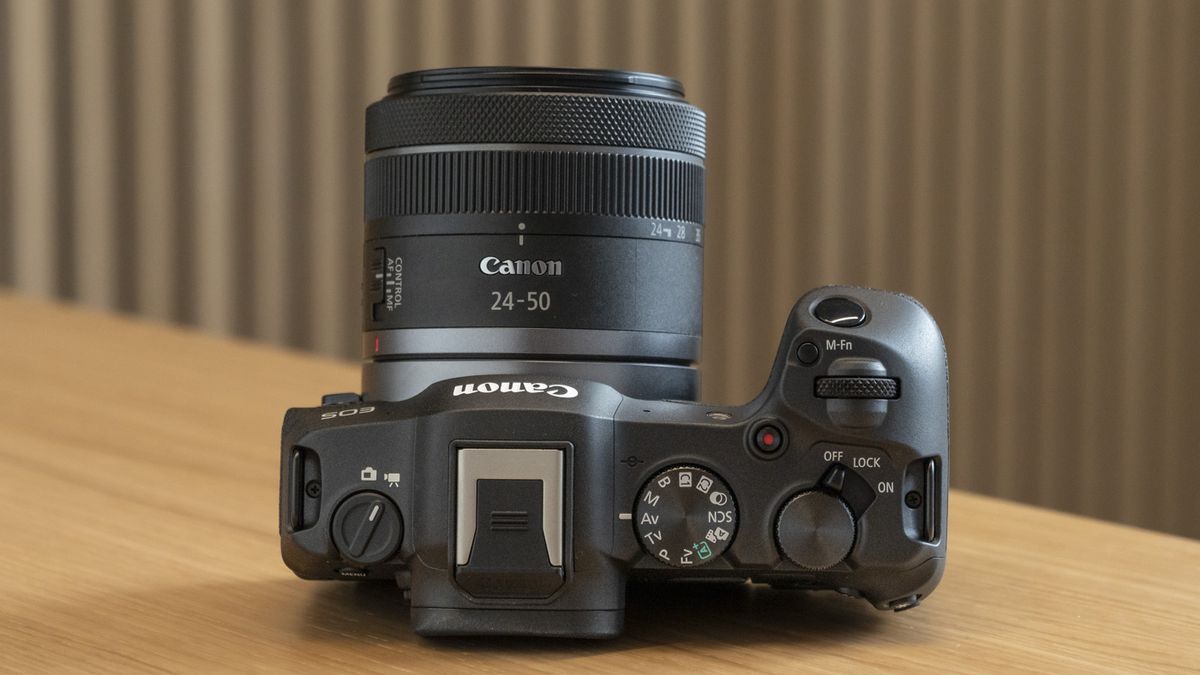 Canon EOS R8 on a table view of the top plate and new RF 24-50mm lens