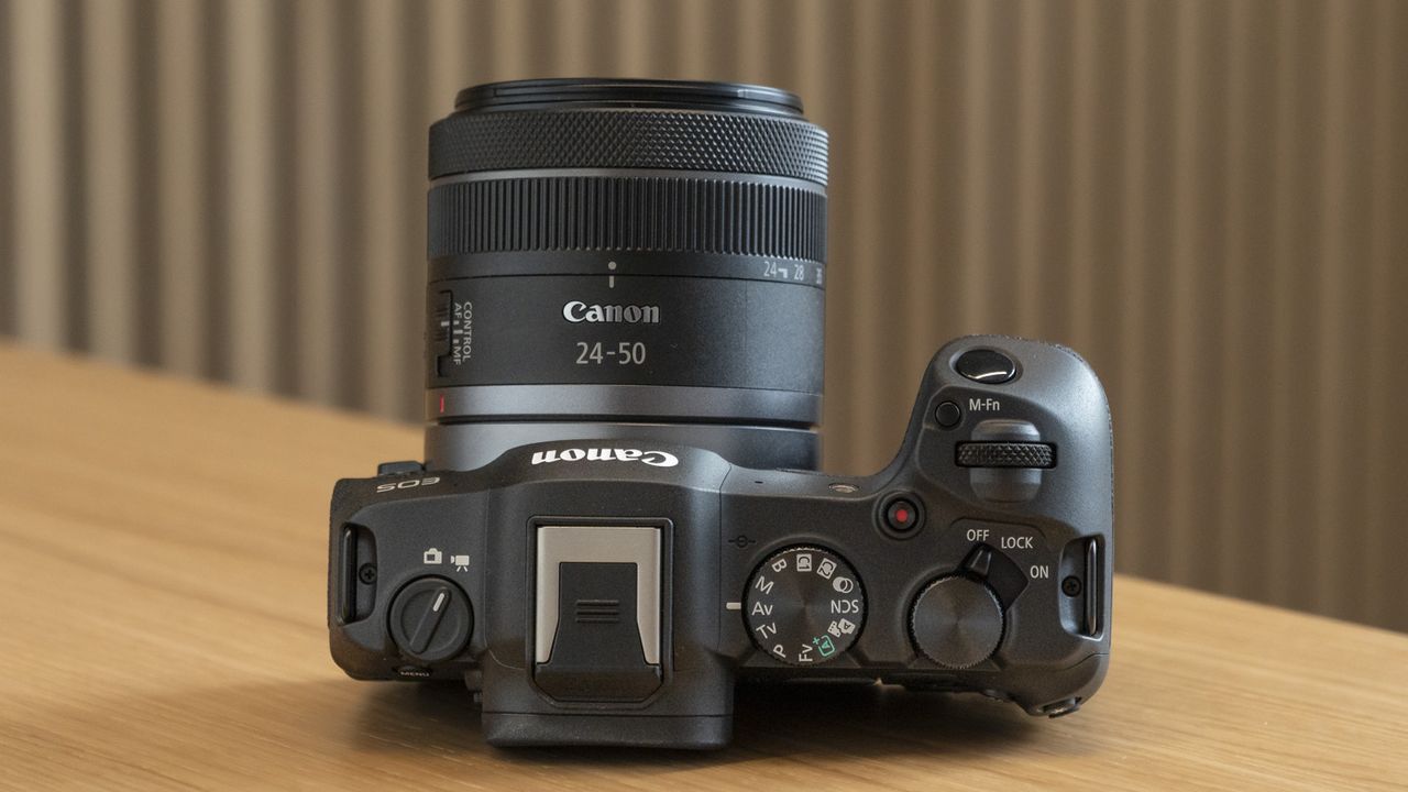 Canon EOS R8 on a table view of the top plate and new RF 24-50mm lens