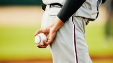 Close up shot of pitcher holding baseball before pitching during game