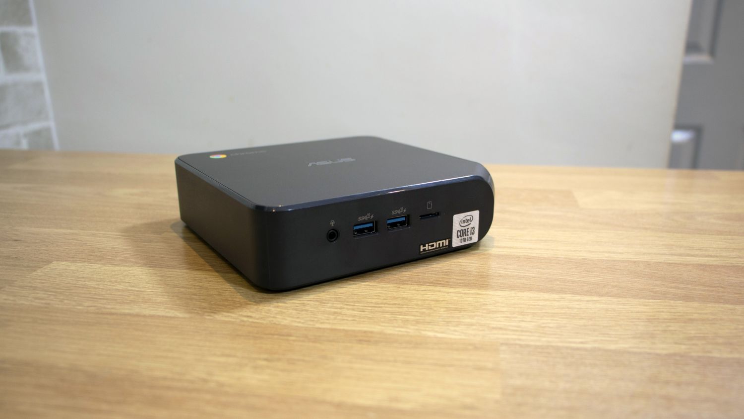 A photograph of the Asus Chromebox 4 sat on a table