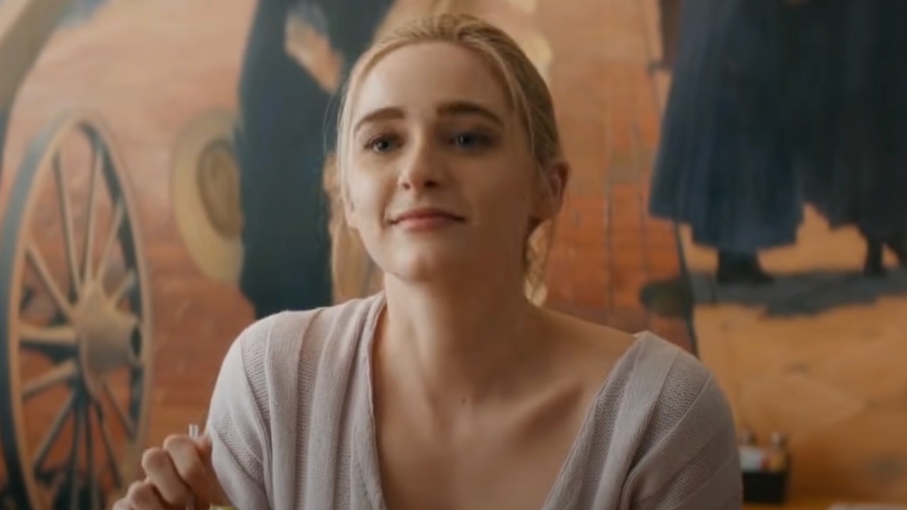 Greer Grammer as Grace staring across the table at a man in Deadly Illusions