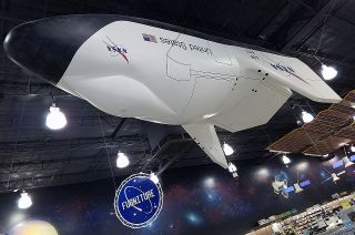 A full-size mockup of NASA's proposed X-38 crew return vehicle was one of the first things shoppers saw when entering Fry's Electronics in Webster, Texas.