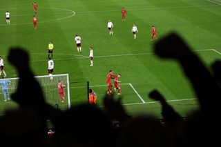 Diogo Jota of Liverpool celebrates scoring his team's second goal during the Premier League match between Liverpool FC and Fulham FC at Anfield on December 14, 2024 in Liverpool, England