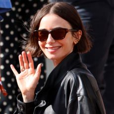 Lily Collins was spotted at the 2026 French Open in an oversize leather bomber jacket