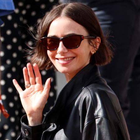 Lily Collins was spotted at the 2026 French Open in an oversize leather bomber jacket