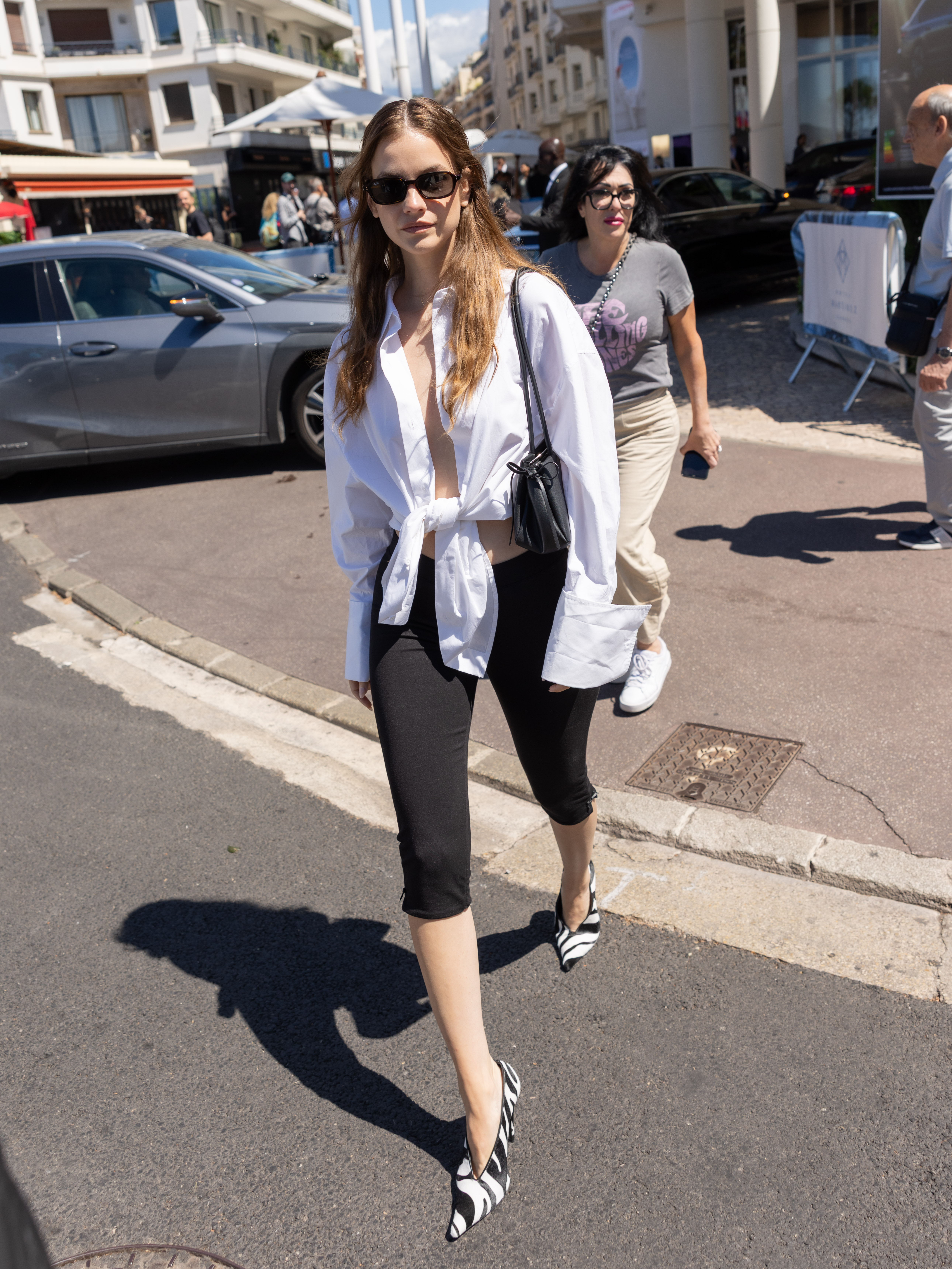 An image of Barbara Palvin showcasing how to wear pedal pushers while out in Cannes in 2025.