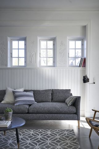 Grey sofa and cushions from Designers Guild