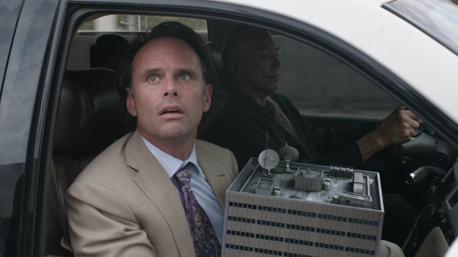 Walton Goggins as Sonny Burch in Ant-Man and the Wasp holding a shrunken building