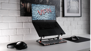 Laptop in home office with stylised letters VPN on the screen