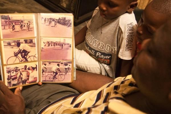 Mustafa Saka shares his cycling album with his children.