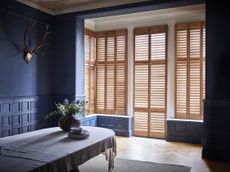 Shutters at French doors in living space by Shutterly Fabulous