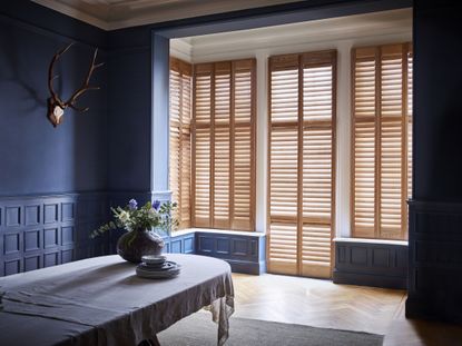 Shutters at French doors in living space by Shutterly Fabulous