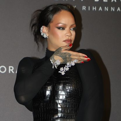 Rihanna Swaps Canary Yellow Mugler for Leather Ala&iuml;a in Mumbai at Fenty launch