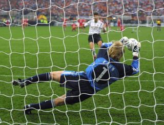 Bayern Munich goalkeeper Oliver Kahn saves a penalty from Valencia's Mauricio Pellegrino in the shootout in the 2001 Champions League final.