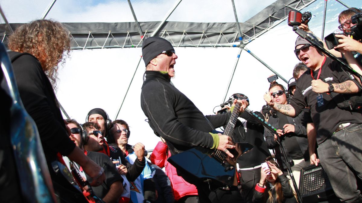 US heavy metal band Metallica's lead vocalist, James Hetfield (C), and lead guitarist Kirck Hammet (L) perform in Antarctica on December 8, 2013.