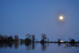 View of supermoon over Lake Ontario from Frenchman’s Bay in Pickering, Ontario.