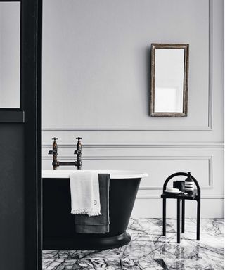 black and white bathroom with freestanding tub