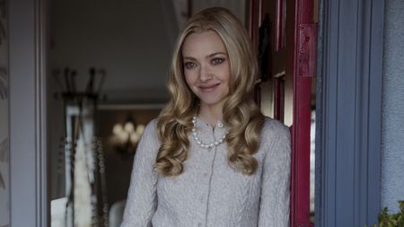 Amanda Seyfried smiling at the door as Nina In The Housemaid 