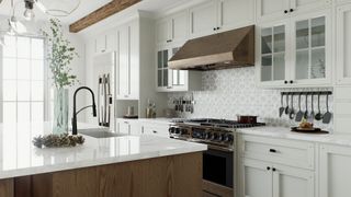 tidy kitchen with white cabinets and island unit