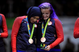 RIO DE JANEIRO, BRAZIL - AUGUST 13: Bronze medalist, Ibtihaj Muhammad of the United States celebrates on the podium with Dagmara Wozniak of the United States during the Women's Sabre Team bronze medal match between United States and Italy on Day 8 of the Rio 2016 Olympic Games at Carioca Arena 3 on August 13, 2016 in Rio de Janeiro, Brazil. (Photo by Tom Pennington/Getty Images)