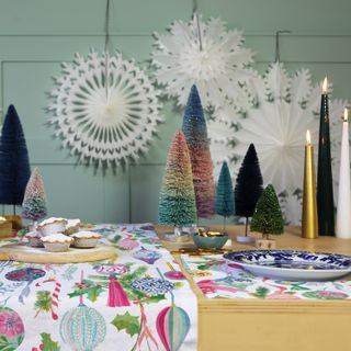 Christmas table runner with painterly designs, festive trees, mince pies