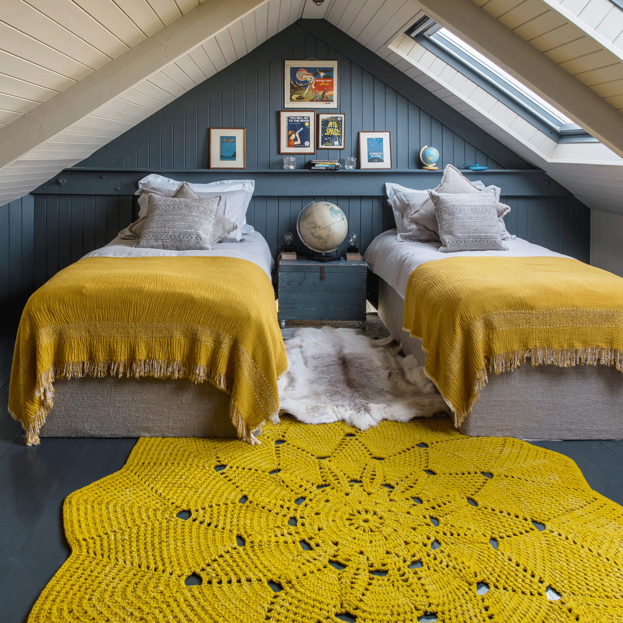 Twin beds with yellow rug