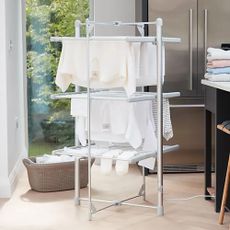 Lakeland Dry:Soon 3-Tier Heated Clothes Airer being used in a family home, in the kitchen, with clothes drying on it
