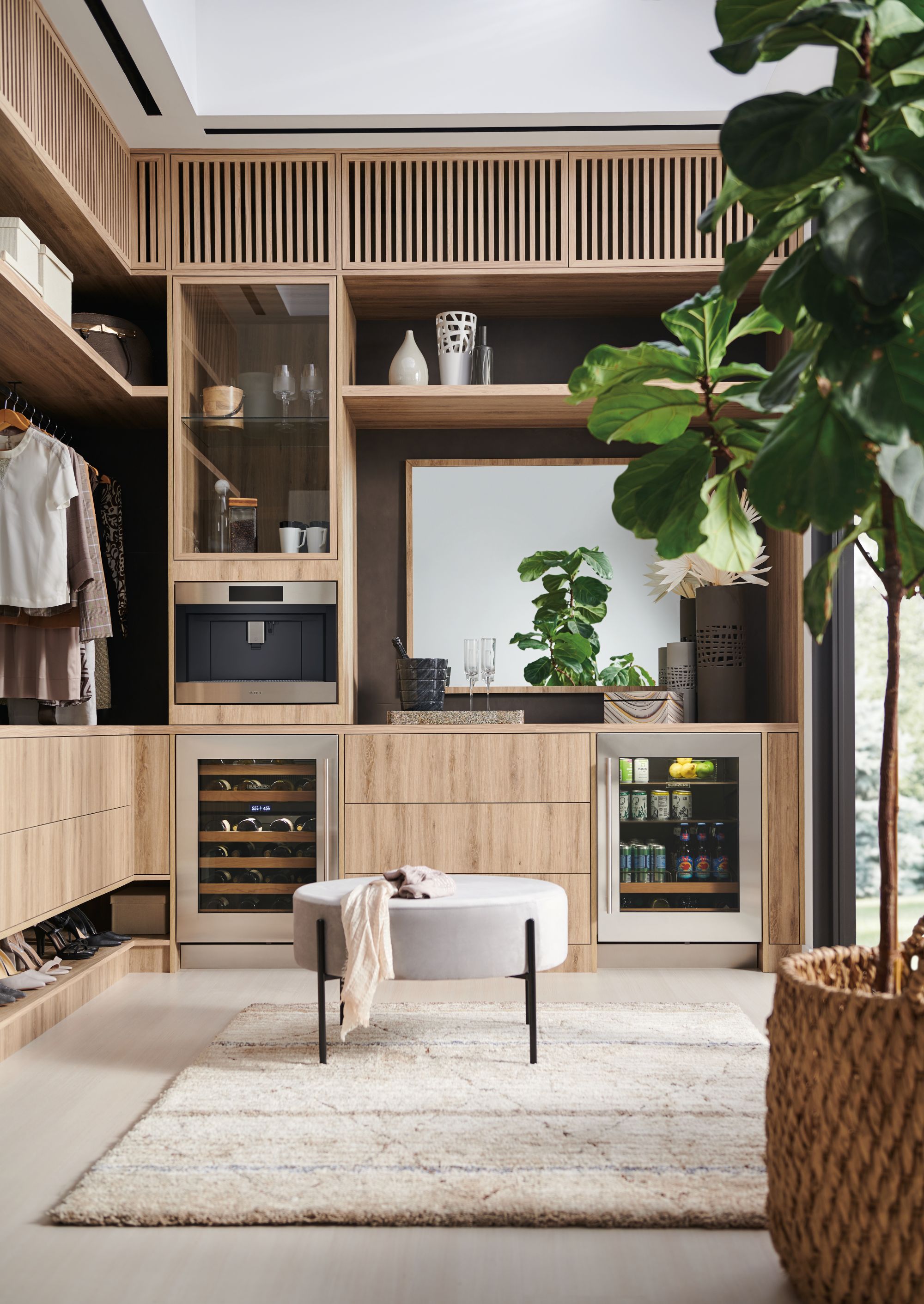 walk in wardrobe with a full drinks station
