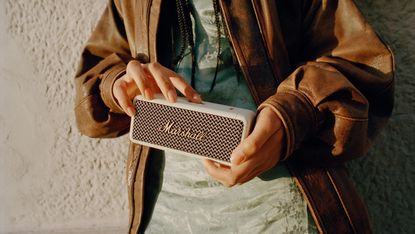 Marshall Emberton II review: person holding a small portable speaker