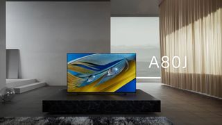 Sony A80J in a brutalist living room with large windows