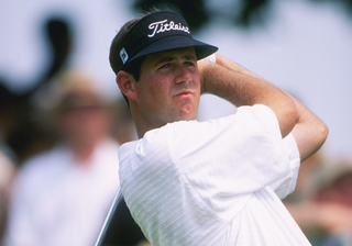 Stewart Cink plays an iron shot in 1996