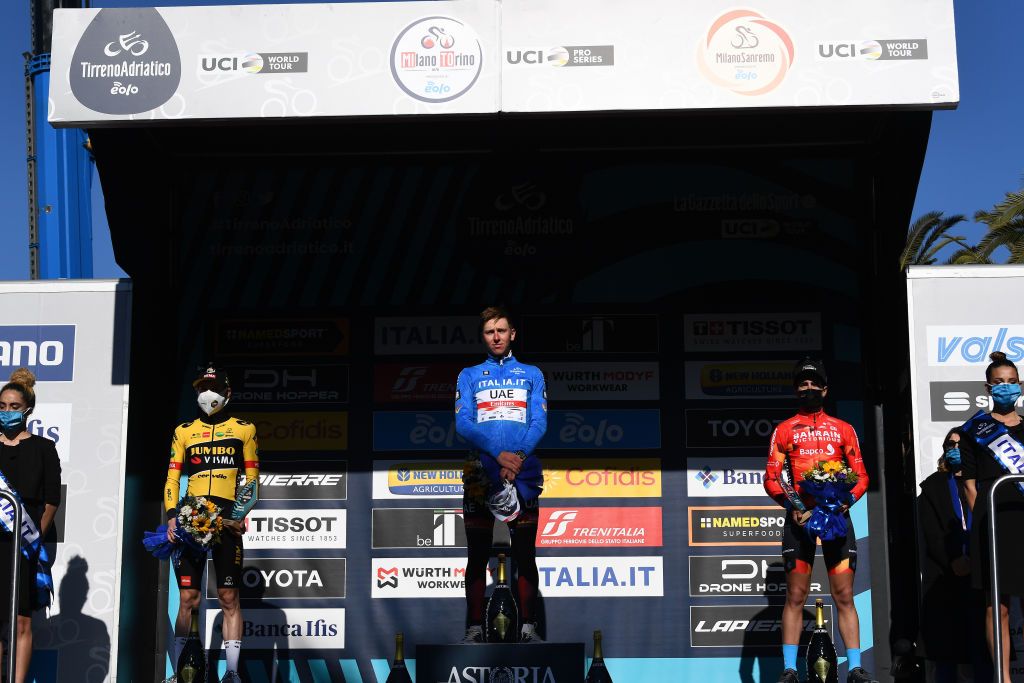 SAN BENEDETTO DEL TRONTO ITALY MARCH 13 LR Jonas Vingegaard Rasmussen of Denmark and Team Jumbo Visma on second place race winner Tadej Pogacar of Slovenia and UAE Team Emirates Blue Leader Jersey and Mikel Landa Meana of Spain and Team Bahrain Victorious on third place pose on the podium ceremony after the 57th TirrenoAdriatico 2022 Stage 7 a 159km stage from San Benedetto del Tronto to San Benedetto del Tronto TirrenoAdriatico WorldTour on March 13 2022 in San Benedetto del Tronto Italy Photo by Tim de WaeleGetty Images