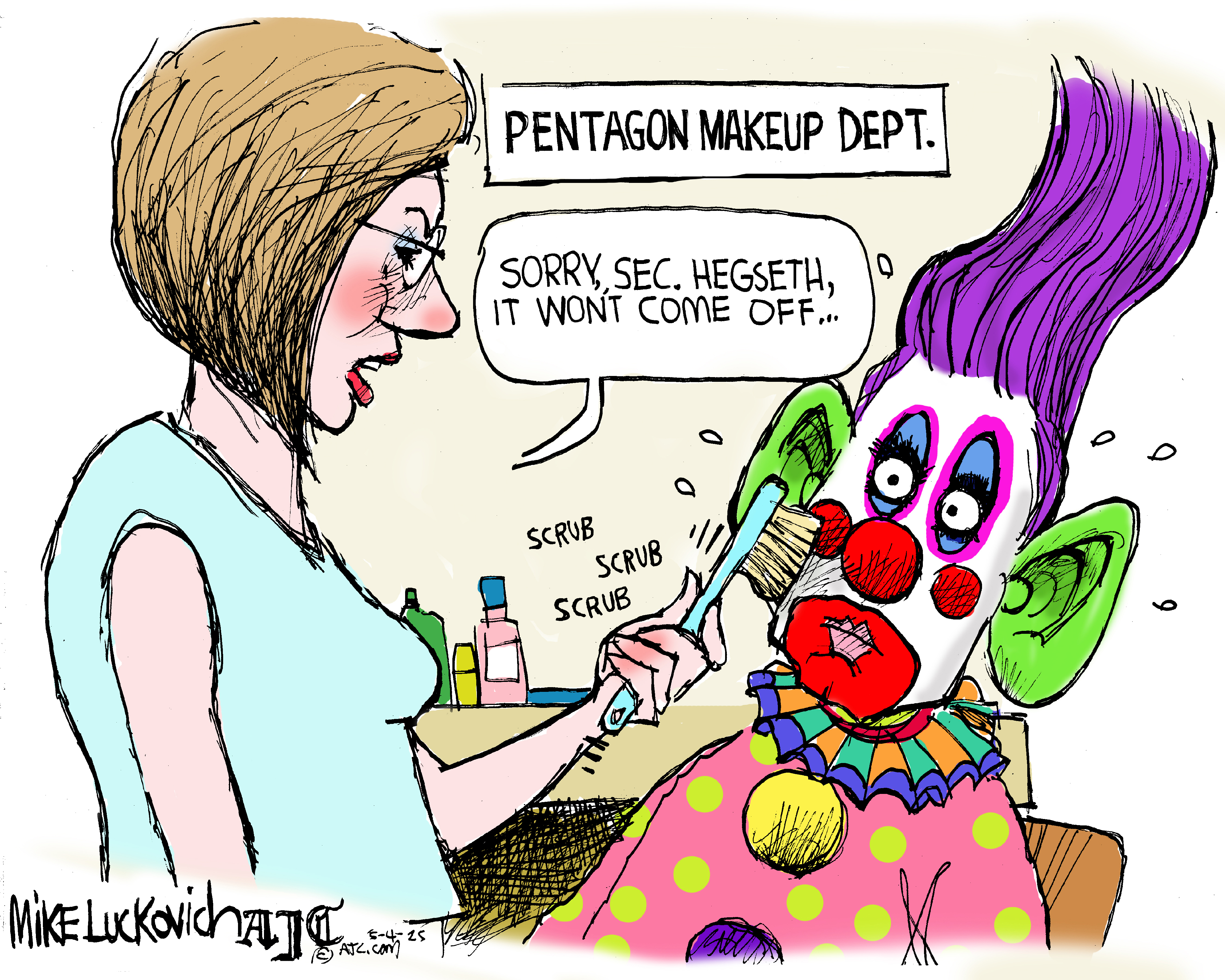 This cartoon depicts a scene at the "PENTAGON MAKEUP DEPT." A person is scrubbing the face of another individual who is dressed as a clown with purple hair, large green ears, and colorful makeup. The person scrubbing says, "SORRY, SEC. HEGSETH, IT WON'T COME OFF..."