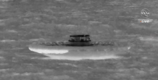 black and white image of loftid in the water